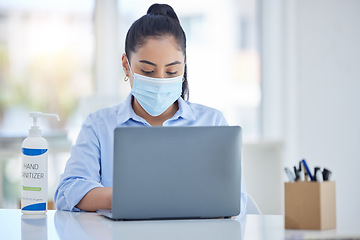 Image showing Business woman with laptop, during covid with mask and hand sanitizer for hygiene and health. Young corporate professional, safety and sanitation while working in office during pandemic.