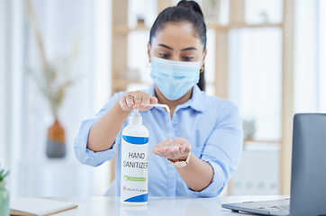 Image showing Sanitizer, covid and employee cleaning hands in the office for dusty germs, health and safety in working environment. Face mask, virus and woman washing from liquid soap bottle for hygiene protection