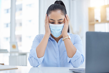 Image showing Stress, covid and headache of a business woman in her office working at desk with laptop for compliance, health problem or tech job. Burnout, anxiety and mental health corporate worker in a face mask