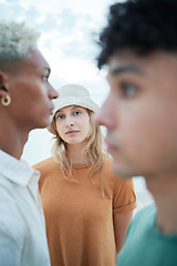 Image showing Beauty, fashion and face with a woman or model standing outdoor with her male friends in winter. Portrait, inclusion and diversity with a young female posing outside in a hat on a white background