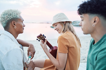Image showing Young friends play music on beach, people on summer holiday and travel outdoor with guitar ukulele in Hawaii. Diversity students vacation together, relax at sea picnic and road trip celebration