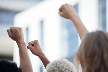 Image showing Fist, activism and crowd solidarity protest against racism and oppression, fight for diversity and equality. Unity, determined activist rally together for human rights violation and freedom of speech