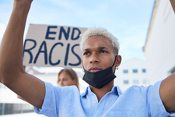 Image showing End racism sign, poster and black man protest in face mask, cardboard in urban street for solidarity, race fight and human rights. Volunteer people with board for freedom, equality and violence stop