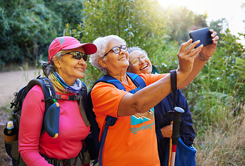 Image showing Senior women, phone selfie and hiking in nature on holiday or summer vacation. Travel, hike and retired friends spending time together on 5g mobile tech, happy memory or picture post for social media