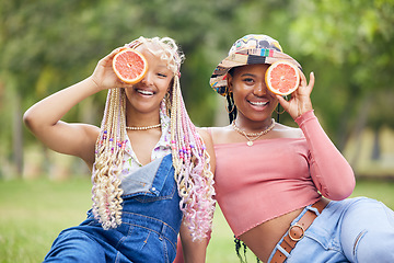 Image showing Grapefruit, smile and friends on a picnic in a park in Australia during summer. Portrait of happy African women on a diet for health with fruit, nutrition and food to detox together in nature