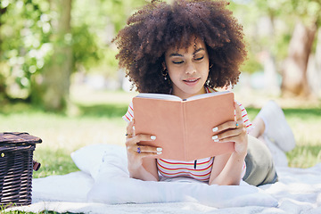 Image showing Picnic, park and reading black woman with book relax for outdoor education, studying and wellness. Black woman notebook for free time leisure, learning or nature self care notes tips with trees bokeh