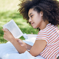Image showing Black woman reading book, relax in park and picnic blanket with novel in nature. Education, learning and female student in Brazil in college or university campus on grass field studying with textbook
