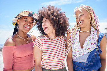 Image showing Beach, vacation and summer with a black woman and her friends enjoying a trip on the coast during their holiday. Travel, fun and a girl friend group outdoor together to relax while laughing or joking