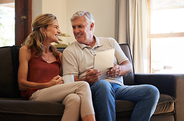 Image showing Tablet, social media and senior couple with smile for choice of movie on the web with coffee on sofa of their house. Elderly man and woman talking about show on subscription service on tech with tea