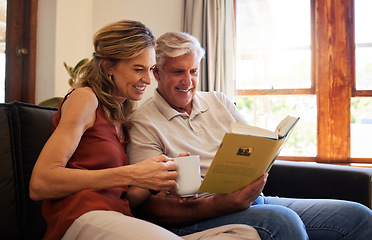 Image showing Book, relax and senior couple reading a story together with coffee on the living room sofa of their house. Elderly man and woman with smile for knowledge from literature with tea on the couch