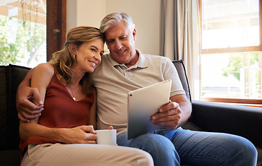 Image showing Tablet, relax and old couple streaming a movie via online subscription or enjoying internet video content on sofa. Smile, love and married woman watching tv with a romantic elderly partner at home