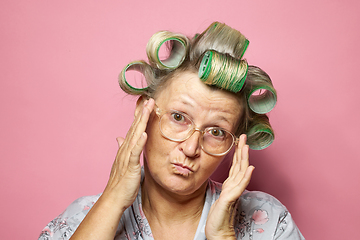 Image showing senior women with hair rollers