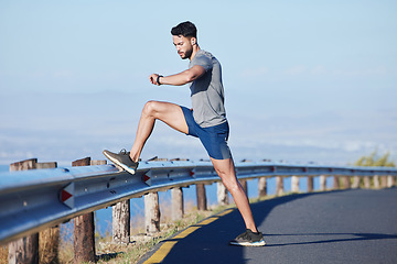Image showing Runner, road and man on time by smartwatch to start running, exercise and cardio workout to burn fat outdoors. Healthy, wellness and athlete monitoring training performance on his fitness journey