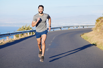 Image showing Fitness, man and running on a mountain road in South Africa for healthy cardio workout in the outdoors. Active athletic male runner in sports training having a run on the street in nature