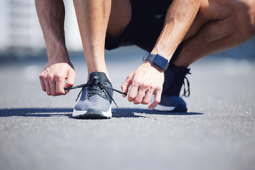 Image showing Hands, lace tie or running shoes in city workout, training or marathon exercise for health, wellness or cardio. Zoom, man or sports runner ready for fitness on road or street with digital smart watch