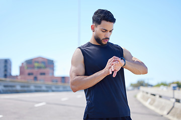 Image showing Man check running stats, health and wellness performance or workout endurance on watch tech. Young athlete cardio training, healthy exercise and sport lifestyle or wellness motivation