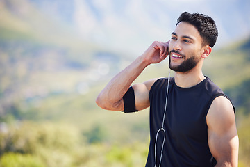 Image showing Fitness, man and runner with earphones in nature with smile for healthy, exercise and training mockup. Happy athletic male smiling in sport workout for cardio wellness, health and music in outdoors