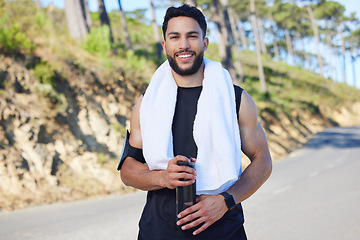 Image showing Portrait, fitness and man with water on the street of Los Angeles after doing cardio training in nature. Happy, asmile and relax athlete runner with drink after running and workout on the road