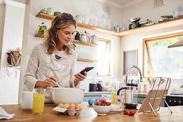 Image showing Baking, website and phone with woman cooking food while reading online with blog, internet or app. Kitchen, network and breakfast with chef with web and search recipe for diet, nutrition or lunch