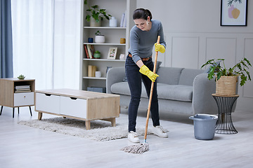 Image showing Mopping, floor and woman cleaning the living room of her house. Cleaner or professional worker with apartment service working in housekeeping, care for home and safety from virus with disinfection