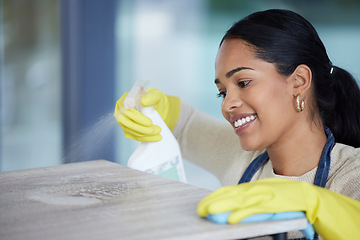 Image showing Clean, woman cleaning office with soap detergent product and cloth to disinfect space from dust and germs. Happy, cleaner service, housekeeper, safety gloves and hygiene sanitation of workspace.