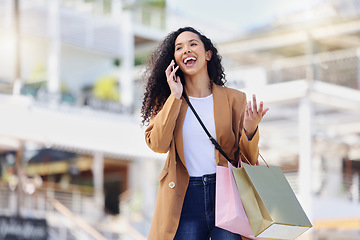 Image showing Happy woman, shopping and phone call in the mall in communication about lifestyle in the outdoors. Female shopper having conversation with smile and laugh on mobile smartphone in the city market