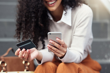 Image showing Online shopping, credit card and woman on a smartphone in the city with phone and bank card in hand. Girl on internet doing shopping, ecommerce and retail purchase. Businesswoman doing online banking
