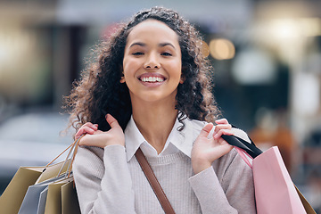 Image showing Shopping, black woman and smile after a shop, fashion retail or luxury store trip with happiness. Portrait of a happy rich young female from Paris or urban city smiling with joy for sale or discount
