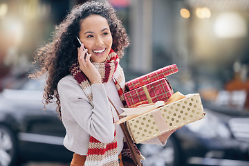 Image showing Woman, christmas shopping and phone call in the city in communication with rich lifestyle outdoor. Female with retail gift in conversation with smile and laugh on mobile smartphone in the a market