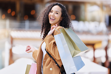 Image showing Shopping, happy and portrait of customer with bag after shopping spree buying retail fashion product on store discount. Sales, smile and young black woman at luxury shopping mall to purchase clothes