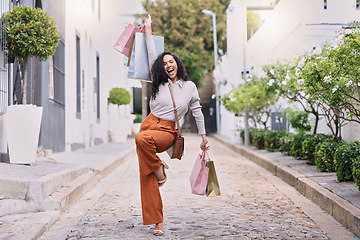 Image showing Happy, excited and woman with shopping on outdoor path with smile. Happiness, fashion and city girl with bag from discount sale. Retail therapy, luxury and customer in celebration on street with bag.