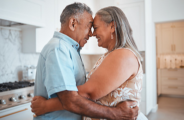 Image showing Hug, love and senior couple with smile for retirement, marriage or support in the kitchen of their house. Happy and elderly man and woman hugging on their anniversary in their home together
