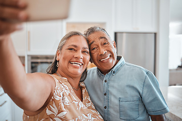 Image showing Selfie, senior couple and happy in kitchen at home being romantic, fun and smile together for anniversary. Retirement, elderly man and woman being loving, bonding or relax indoors for love or romance