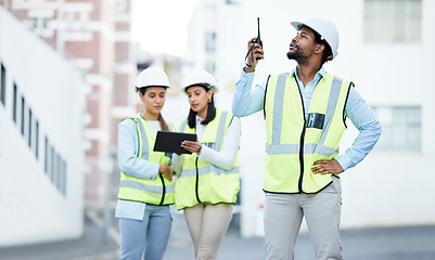 Image showing Communication, construction and architect worker talking on tech about building project in the city of Canada. African engineer speaking about architecture on walkie talkie with team on a tablet