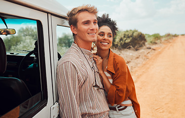 Image showing Happy couple, travel and smile for road trip in the countryside on vacation together in nature. Interracial man and woman smile for relationship traveling, adventure and holiday bonding in the desert