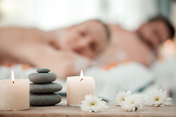 Image showing Background of aromatherapy candles, spa and couple luxury skincare, zen wellness and relax body at vacation salon. Closeup of massage stones, calm space and holistic beauty service for stress relief