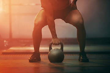 Image showing Fitness, gym and sports training with kettlebell of athlete in exercise, workout and motivation indoors. Strong athletic hand ready with sport equipment exercising for strength, health and wellness