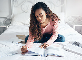 Image showing Study, learning and student bedroom bed work of a black woman studying for a university exam. Home working, college book and education scholarship reading of a person in a house feeling calm