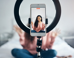 Image showing Live streaming, phone and black woman talking on video podcast in the bedroom of her house. Happy and excited girl or influencer speaking on the internet or social media with a mobile and ring light