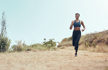 Image showing Fitness, running and black woman on nature trail for marathon cardio exercise in Hollywood USA. African American athlete enjoying outdoor run for training and cardiovascular health lifestyle.