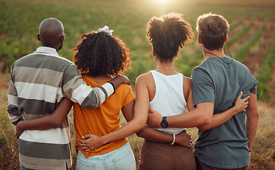 Image showing Diversity, view and friends together hug, friendship and love on a countryside farm in France. People relax, back and summer people on holiday vacation in nature, vineyard or outdoor during sunset