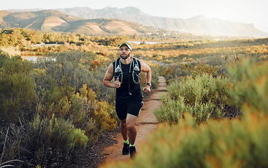 Image showing Runner, fitness or nature workout on mountains path, countryside landscape or sustainability environment. Sports man, athlete or running for health exercise, wellness workout or heart cardio training