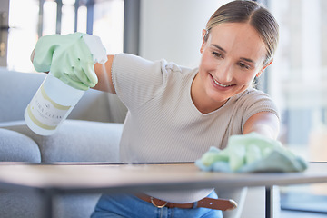 Image showing Woman spring cleaning home furniture with spray product, cloth and living room table. Happy cleaner service, maid and housekeeper liquid bottle disinfection task, dust and routine apartment lifestyle