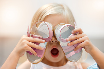 Image showing Girl child shopping for shoes, wow discount price in retail store and funny crazy face. Excited, young kid in boutique toddler sale, future footwear designer holding sandals and pink surprise gift