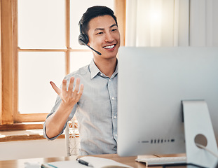 Image showing Call center, telemarketing and customer support consultant working on a computer in modern office. Happy, smile and asian man doing online consultation for ecommerce sales, customer service and crm.