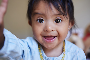 Image showing Children, down syndrome and selfie with a girl taking a photograph while looking cute or adorable. Kids, disability and picture with a young female child posing for a self portrait alone in her home