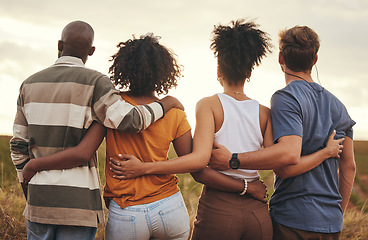 Image showing Friends together, travel and adventure, embrace at sunset on roadtrip in countryside during summer holiday. Support, diverse men and women bonding, peace and relaxing outdoor in nature at dusk