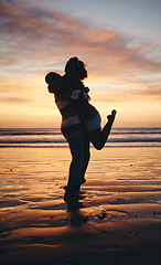 Image showing Silhouette couple, sunset beach love and hug on honeymoon, summer tropical vacation and anniversary date together in Maldives. Shadow of man lifting woman, playing and happy ocean holiday freedom