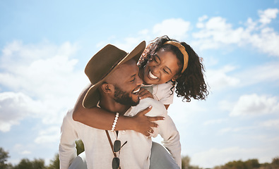 Image showing A happy back couple, smile and man piggyback wife enjoying quality time in love together on summer vacation. Married woman, husband travel on holiday road trip and explore desert together in sunshine