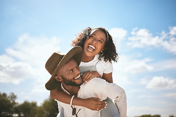 Image showing Piggyback, love and couple with smile on a date in nature together during summer. Happy, playful and African man and woman beeing funny, crazy and young in a green park or garden during spring